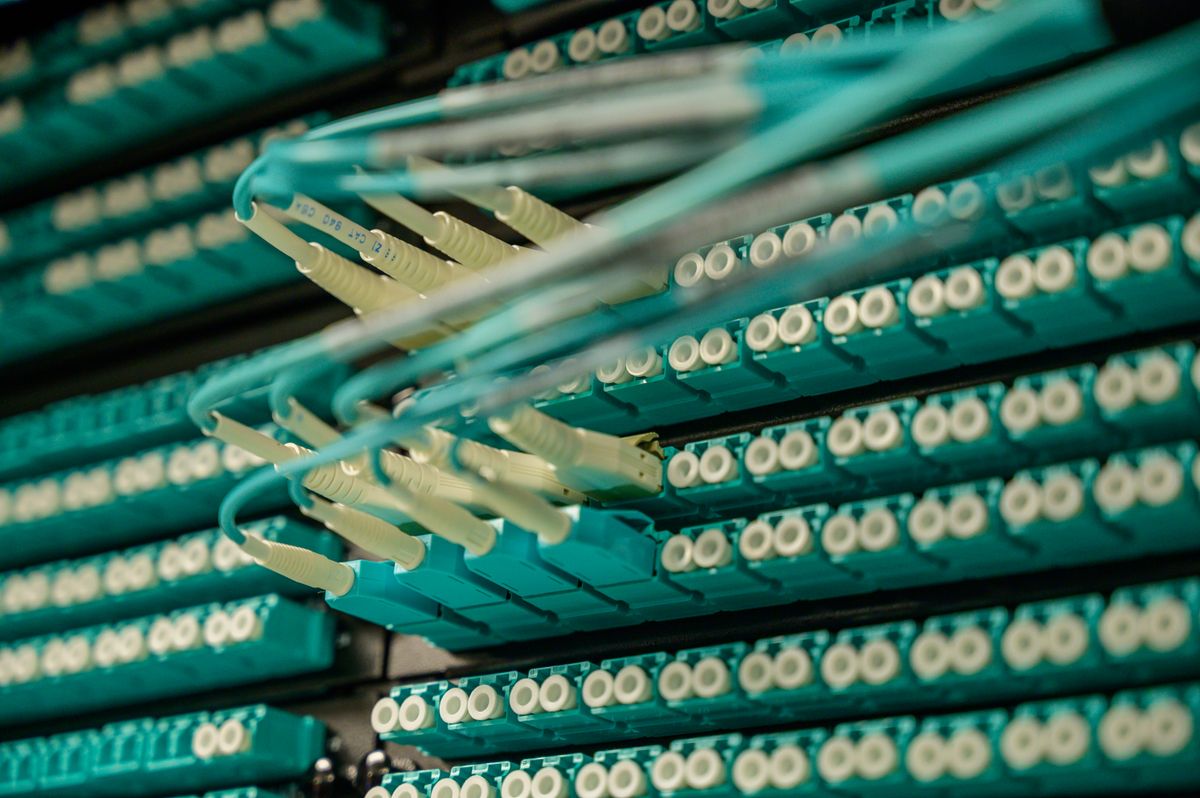 Fiber optic cables connected to a server rack